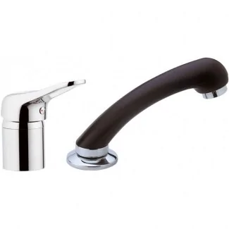 Hairdresser's mixer tap with hand shower on table and flexible hose